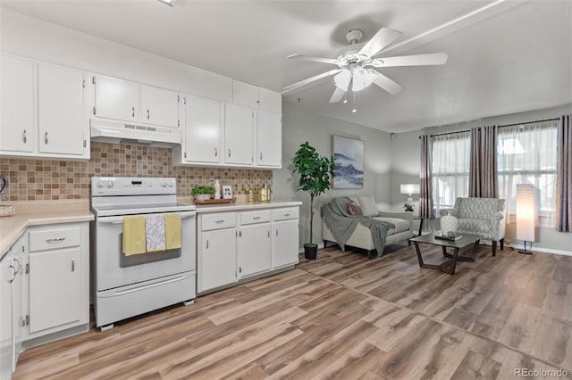 7310 Granada Rd, Denver, CO 80221 - kitchen with white electric range, under cabinet range hood, a ceiling fan, light countertops, and open floor plan