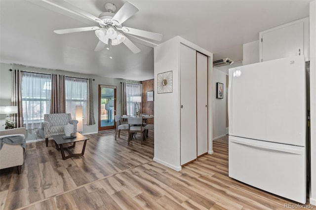 7310 Granada Rd, Denver, CO 80221 - living area with light wood finished floors and a ceiling fan