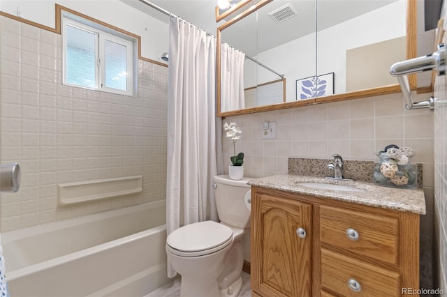 7310 Granada Rd, Denver, CO 80221 - full bath featuring tile walls, vanity, tasteful backsplash, and shower / bath combo with shower curtain