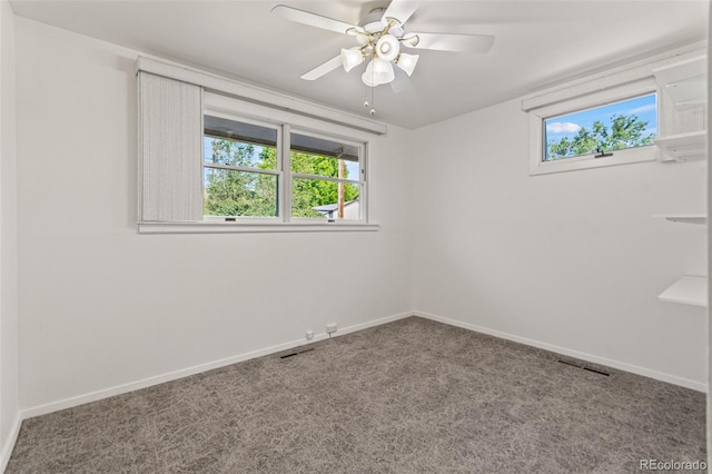7310 Granada Rd, Denver, CO 80221 - carpeted empty room featuring plenty of natural light and a ceiling fan