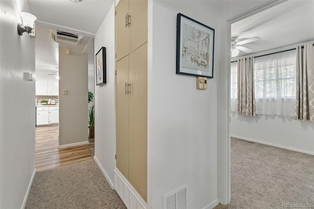 7310 Granada Rd, Denver, CO 80221 - hallway featuring light carpet and attic access