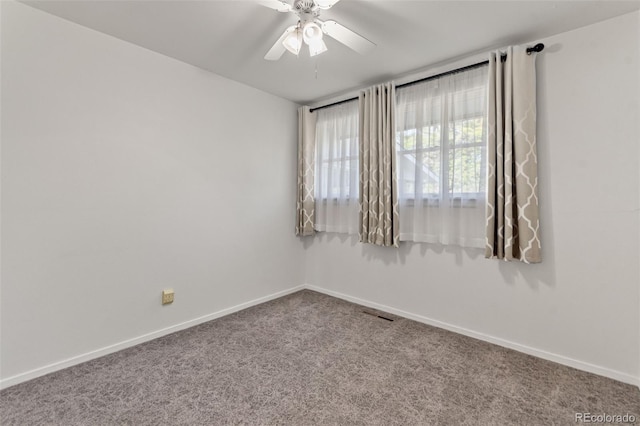 7310 Granada Rd, Denver, CO 80221 - carpeted spare room featuring baseboards and a ceiling fan