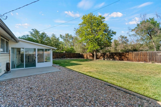 7310 Granada Rd, Denver, CO 80221 - fenced backyard with a sunroom and a patio area