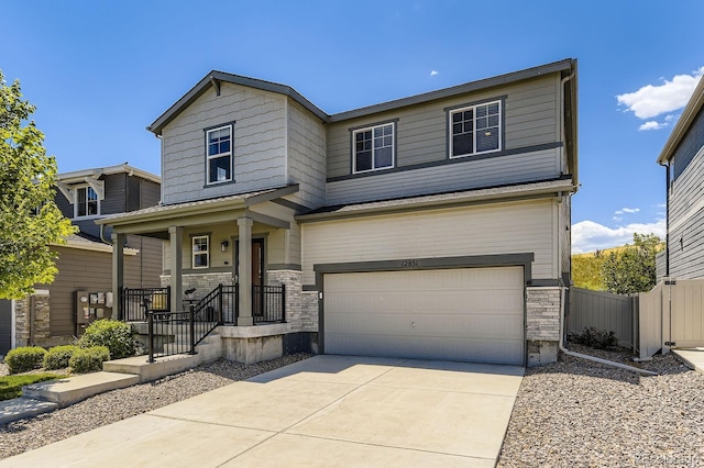 12851 Billingsley Trl, Parker, CO 80134 - view of front facade with an attached garage, stone siding, and concrete driveway