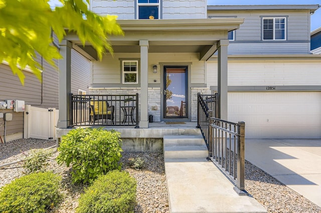 12851 Billingsley Trl, Parker, CO 80134 - property entrance with a garage, a porch, and concrete driveway