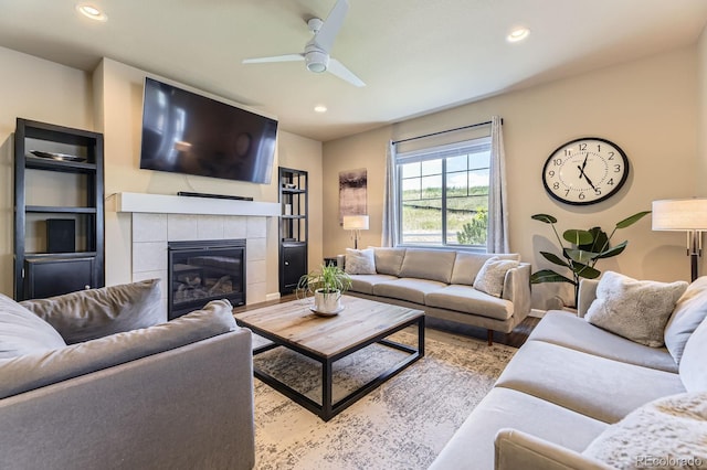 12851 Billingsley Trl, Parker, CO 80134 - living area featuring recessed lighting, ceiling fan, a tiled fireplace, and wood finished floors