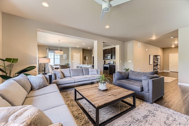 12851 Billingsley Trl, Parker, CO 80134 - living room with light wood-style floors, a ceiling fan, and recessed lighting