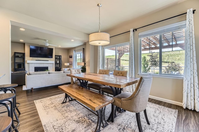 12851 Billingsley Trl, Parker, CO 80134 - dining space with recessed lighting, ceiling fan, a tile fireplace, and dark wood-style floors