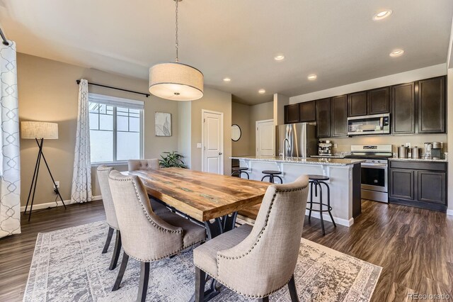 12851 Billingsley Trl, Parker, CO 80134 - dining space featuring dark wood finished floors and recessed lighting