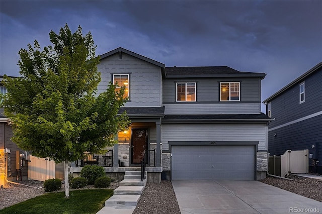 12851 Billingsley Trl, Parker, CO 80134 - view of front of property with a garage, concrete driveway, and stone siding
