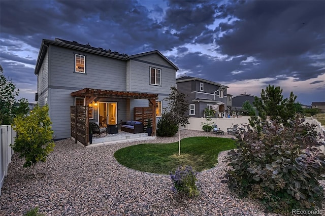 12851 Billingsley Trl, Parker, CO 80134 - back of property at dusk featuring an outdoor living space, a pergola, a patio, and a fenced backyard