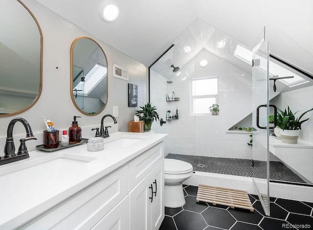 full bath featuring a shower stall, toilet, visible vents, and a sink