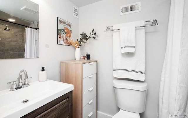 full bath with visible vents, toilet, and vanity