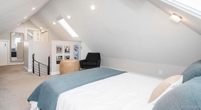 carpeted bedroom featuring recessed lighting and vaulted ceiling with skylight