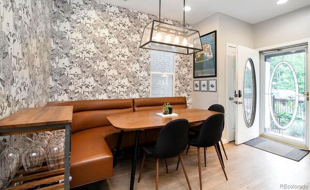 dining room with recessed lighting and wood finished floors