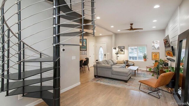 living room with recessed lighting, baseboards, light wood-style flooring, and ceiling fan