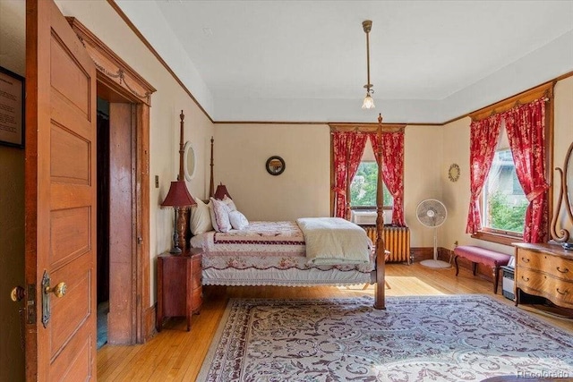 310 E 2nd St, Trinidad, CO 81082 - bedroom with light wood-type flooring, radiator, and cooling unit