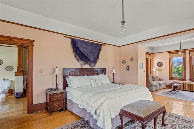 310 E 2nd St, Trinidad, CO 81082 - bedroom featuring light wood finished floors and radiator heating unit