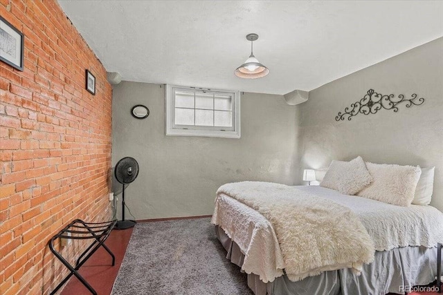 310 E 2nd St, Trinidad, CO 81082 - bedroom featuring carpet floors, brick wall, and baseboards