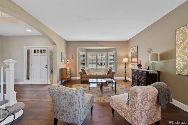 7056 S Owens St, Littleton, CO 80127 - living room featuring arched walkways, wood finished floors, baseboards, and recessed lighting