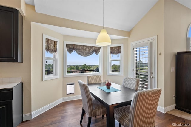 7056 S Owens St, Littleton, CO 80127 - dining space featuring dark wood-type flooring, baseboards, and vaulted ceiling