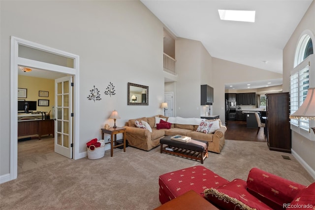 7056 S Owens St, Littleton, CO 80127 - living area featuring carpet flooring, an office area, high vaulted ceiling, baseboards, and french doors