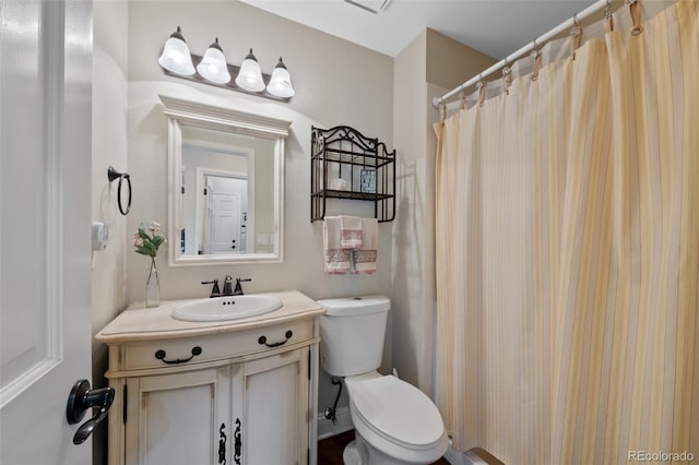 7056 S Owens St, Littleton, CO 80127 - bathroom featuring toilet, vanity, and a shower with shower curtain