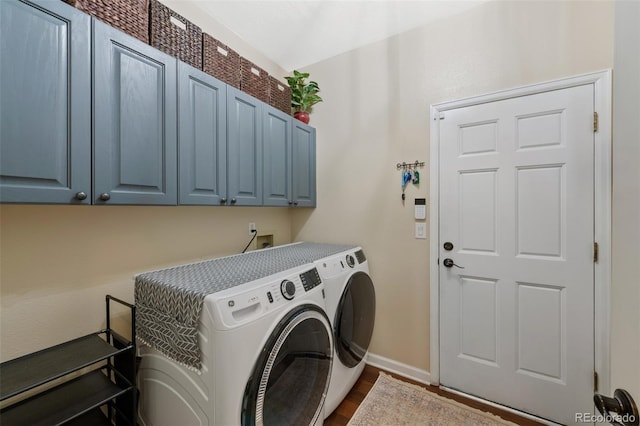 7056 S Owens St, Littleton, CO 80127 - washroom featuring cabinet space, independent washer and dryer, dark wood-style flooring, and baseboards