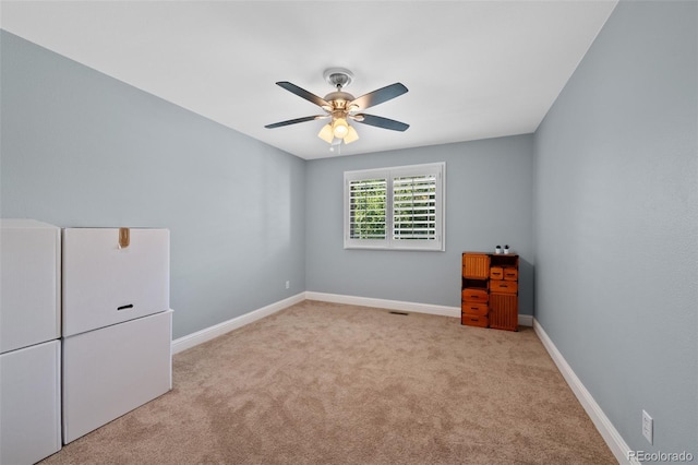 7056 S Owens St, Littleton, CO 80127 - unfurnished bedroom featuring carpet flooring, baseboards, and a ceiling fan