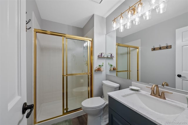 7056 S Owens St, Littleton, CO 80127 - bathroom featuring toilet, vanity, and a stall shower