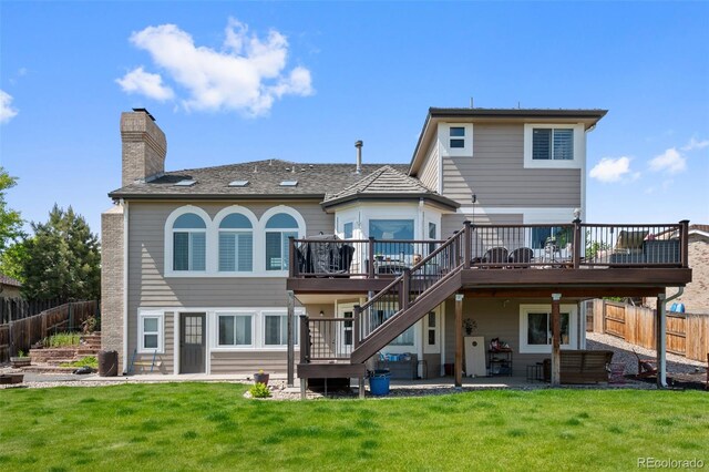 7056 S Owens St, Littleton, CO 80127 - rear view of house with a wooden deck, stairway, a chimney, and a patio area