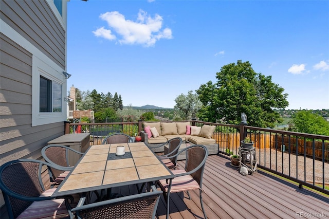 7056 S Owens St, Littleton, CO 80127 - deck with a mountain view and outdoor dining space