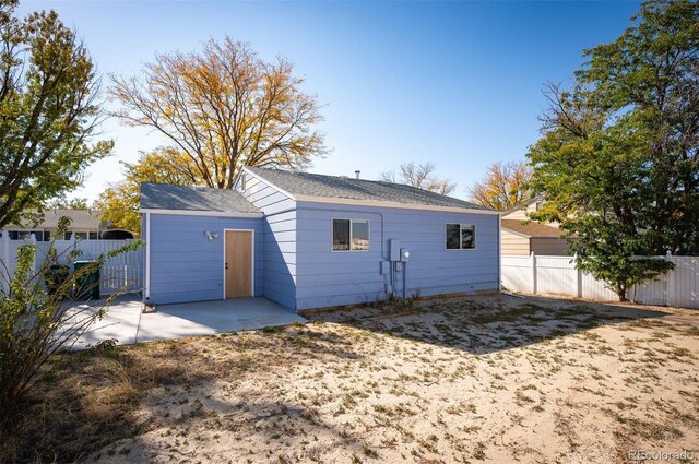 back of property with a patio area