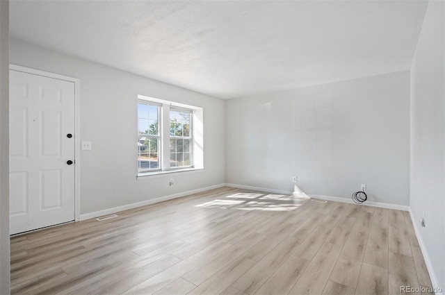 unfurnished room featuring light hardwood / wood-style flooring