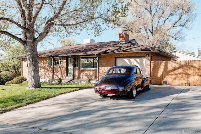 ranch-style house featuring brick siding, an attached garage, driveway, and a chimney