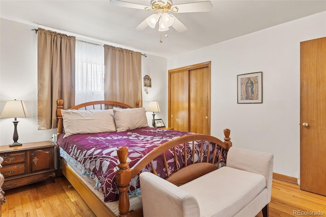 bedroom featuring light hardwood / wood-style flooring, a closet, and ceiling fan