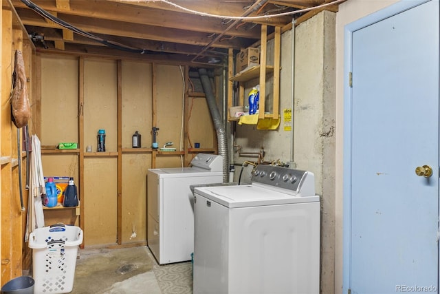 clothes washing area featuring independent washer and dryer