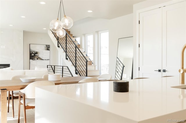 kitchen featuring recessed lighting, pendant lighting, and white cabinets