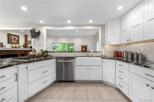7330 Routt St, Arvada, CO 80005 - kitchen featuring stainless steel appliances, backsplash, white cabinets, dark stone counters, and recessed lighting