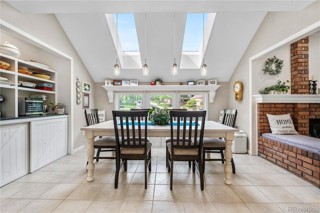 7330 Routt St, Arvada, CO 80005 - dining space featuring a skylight, vaulted ceiling, and light tile patterned flooring