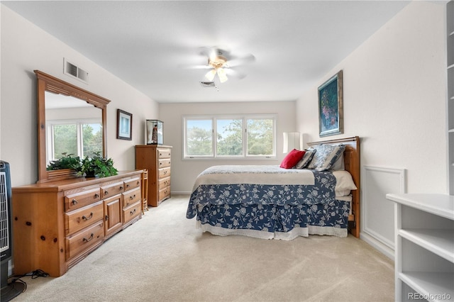 7330 Routt St, Arvada, CO 80005 - bedroom with light colored carpet, multiple windows, and ceiling fan