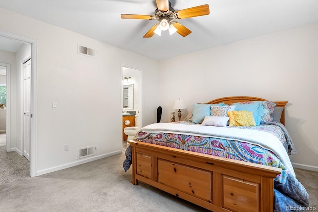 7330 Routt St, Arvada, CO 80005 - carpeted bedroom featuring connected bathroom and ceiling fan