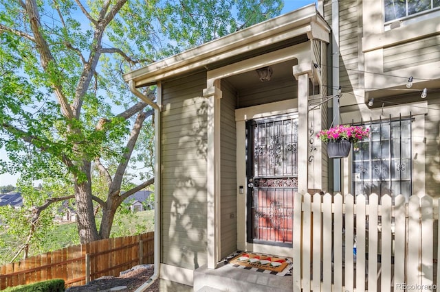 property entrance with fence