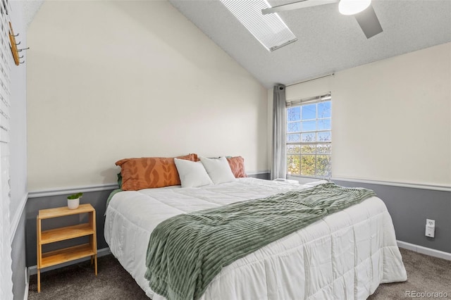 bedroom featuring carpet, vaulted ceiling, baseboards, and a ceiling fan
