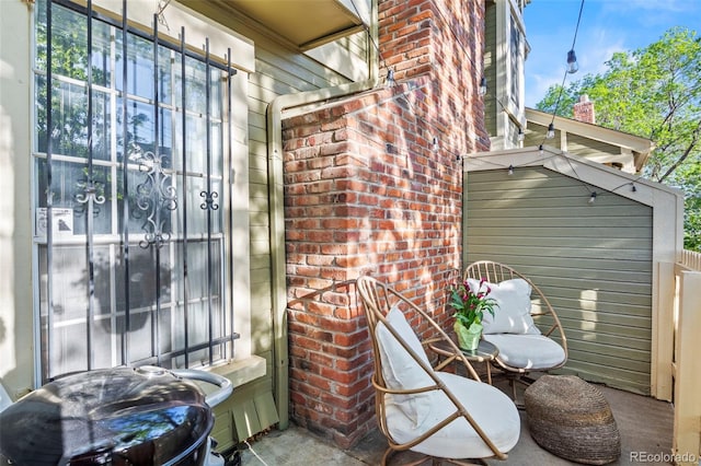 entrance to property featuring brick siding