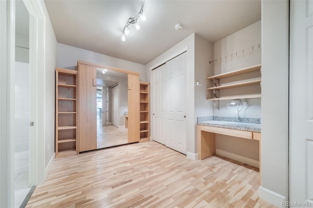 interior space featuring light hardwood / wood-style floors and built in desk