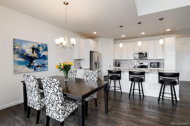 11823 Barrentine Loop, Parker, CO 80138 - dining room with dark wood-style flooring, a chandelier, and recessed lighting