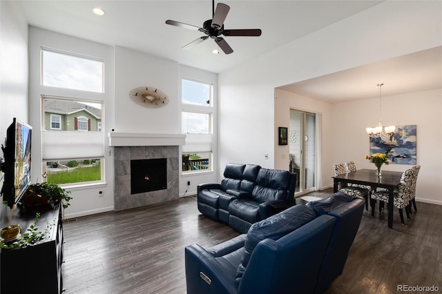 11823 Barrentine Loop, Parker, CO 80138 - living room featuring a chandelier, dark wood-style floors, recessed lighting, ceiling fan, and a tile fireplace