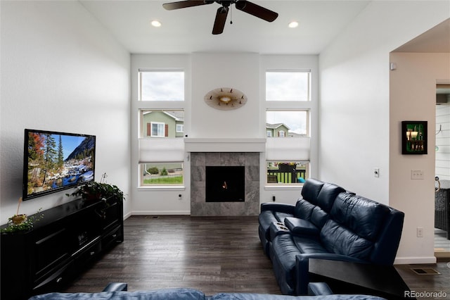 11823 Barrentine Loop, Parker, CO 80138 - living area with a ceiling fan, wood finished floors, healthy amount of natural light, a fireplace, and recessed lighting