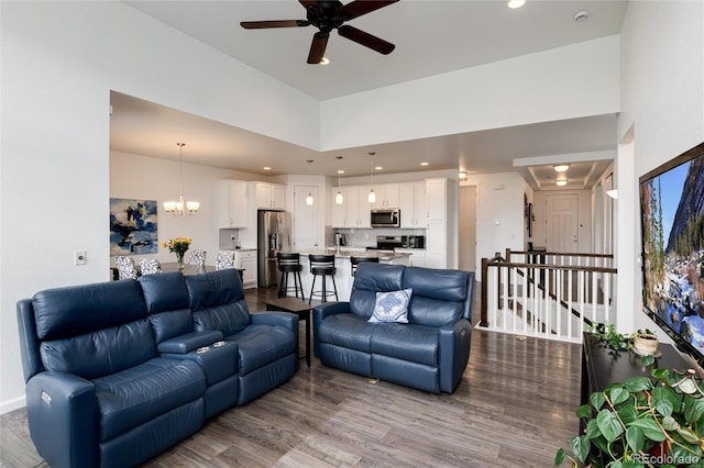 11823 Barrentine Loop, Parker, CO 80138 - living area with ceiling fan, dark wood-style flooring, a chandelier, and recessed lighting